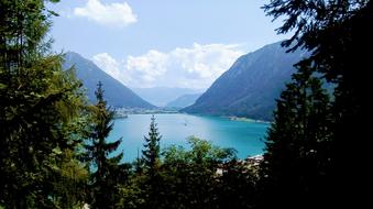 Beautiful landscape of the Achensee lake among the trees and mountains, in Austria