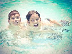 Children swim in the pool