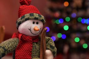 funny snowman on christmas bokeh background