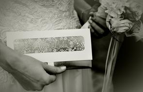 hands of the bride with accessories close-up in black and white background