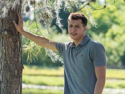 handsome Young Man beneath tree