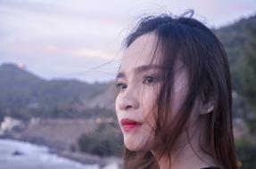 sad woman on blurred nature background
