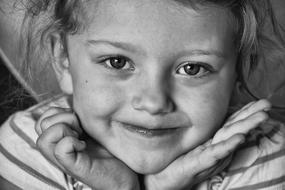 black and white photo of a happy little girl