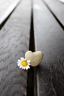 Stone Heart on a wooden surface close-up