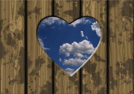 sky through heart shape hole in boards