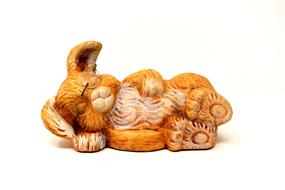 wooden figurine in the form of a sleeping hare