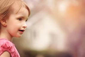 little girl on a blurred background