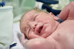 childbirth close-up on blurred background