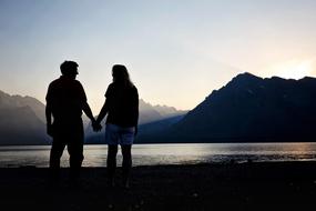 couple in love near the lake during sunrise