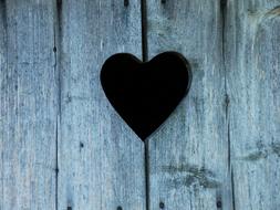 Beautiful heart shape in the wooden wall