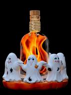 Beautiful and colorful Halloween decoration with the ghosts and bottle with flame, at black background