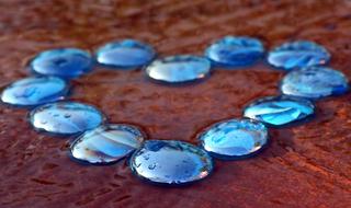 water droplets on blue stones, heart shape