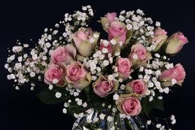 Bouquet of the beautiful, colorful rose and white flowers, at black background