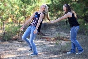 girlfriends frolic in the meadow