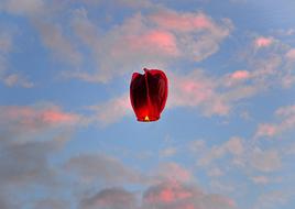 burning lanterns in the sky in the evening