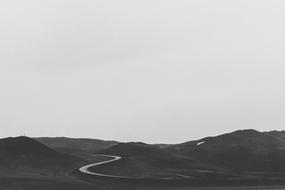 road among the hills in black and white background