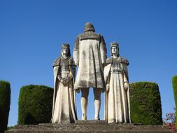 sculpture of people at the wedding against the blue sky