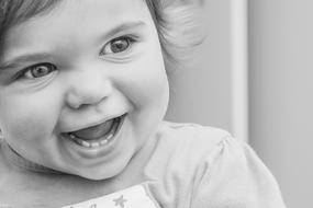 black and white laughing little girl