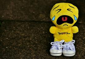 sad smiley in white sneakers