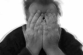 Black and white photo of a man covering face with hands, in blur, at white background, clipart