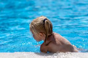 Girl in Swimming Pool at Summer