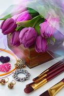 women's jewelry near bouquets of tulips