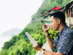 Coffee drinking man at Aceh Mountain