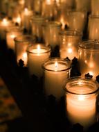 candles with flames on the memorial close-up