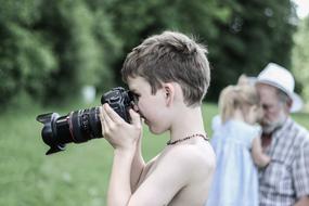 boy with professional camera