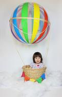 happy child with hot air balloon at photo shoot