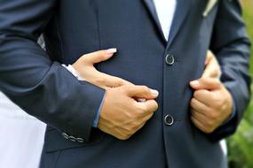 bride's hands in the hands of the groom