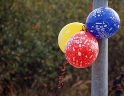 colorful balloons on the pole