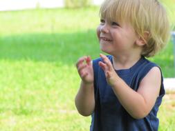 happy child on blurred nature background