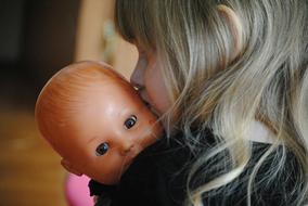 Girl and Baby Doll