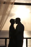 Lovers Kissing at sunset