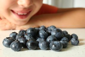 child and Blueberries Berries