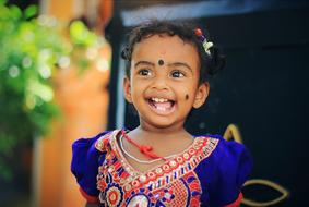 cute happy indian Child girl laughing