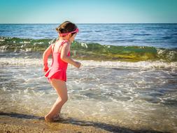 Girl paly sea water