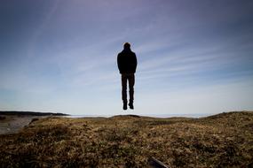 Man Jumping on coastline