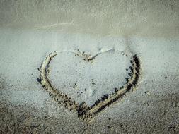 Faded Love, Heart outline on sand
