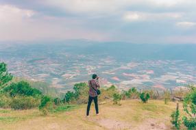Boy making photo of nature