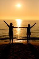 Sunset Silhouette people hand up