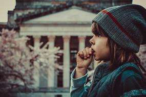 cute caucasian child Boy with finger in his mouth