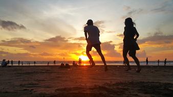 Beaches Couple play Sunset