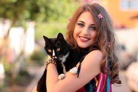 happy caucasian Girl with black white Cat portrait