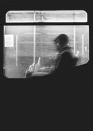 Black And White photo of Man in bus