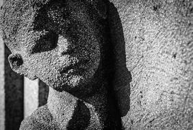 stone head boy, sculpture in the cemetery