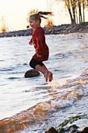 child jumping at Sea beach