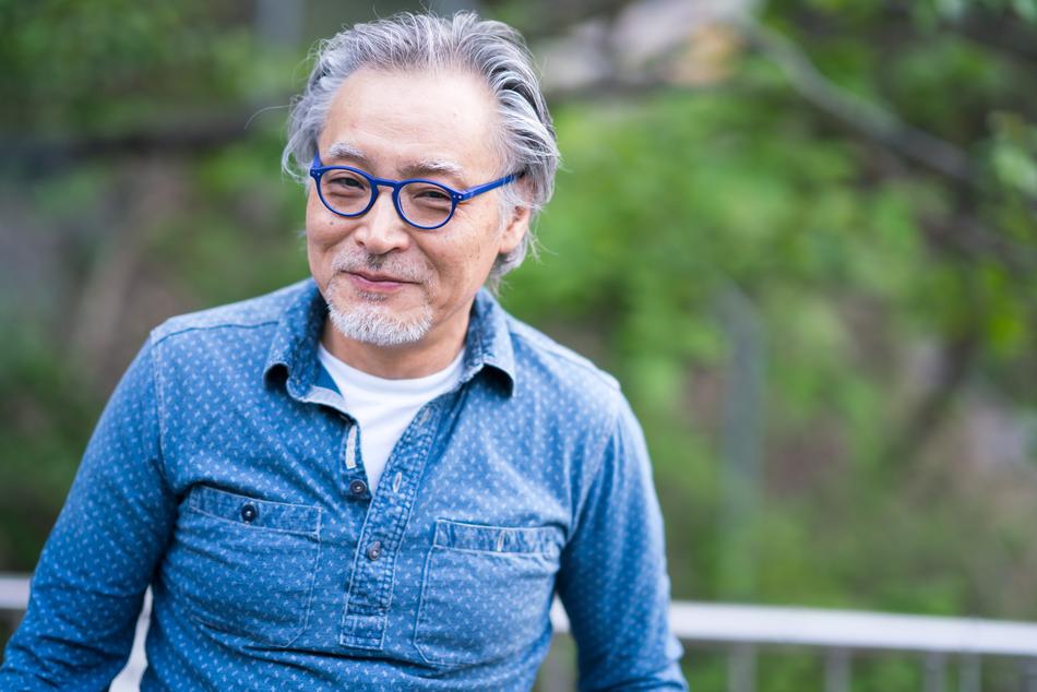 Aged Man in blue shirt