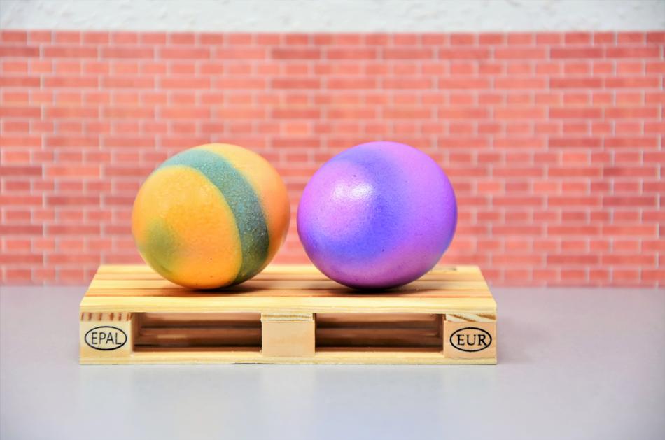 two Colored Easter Eggs on pallet